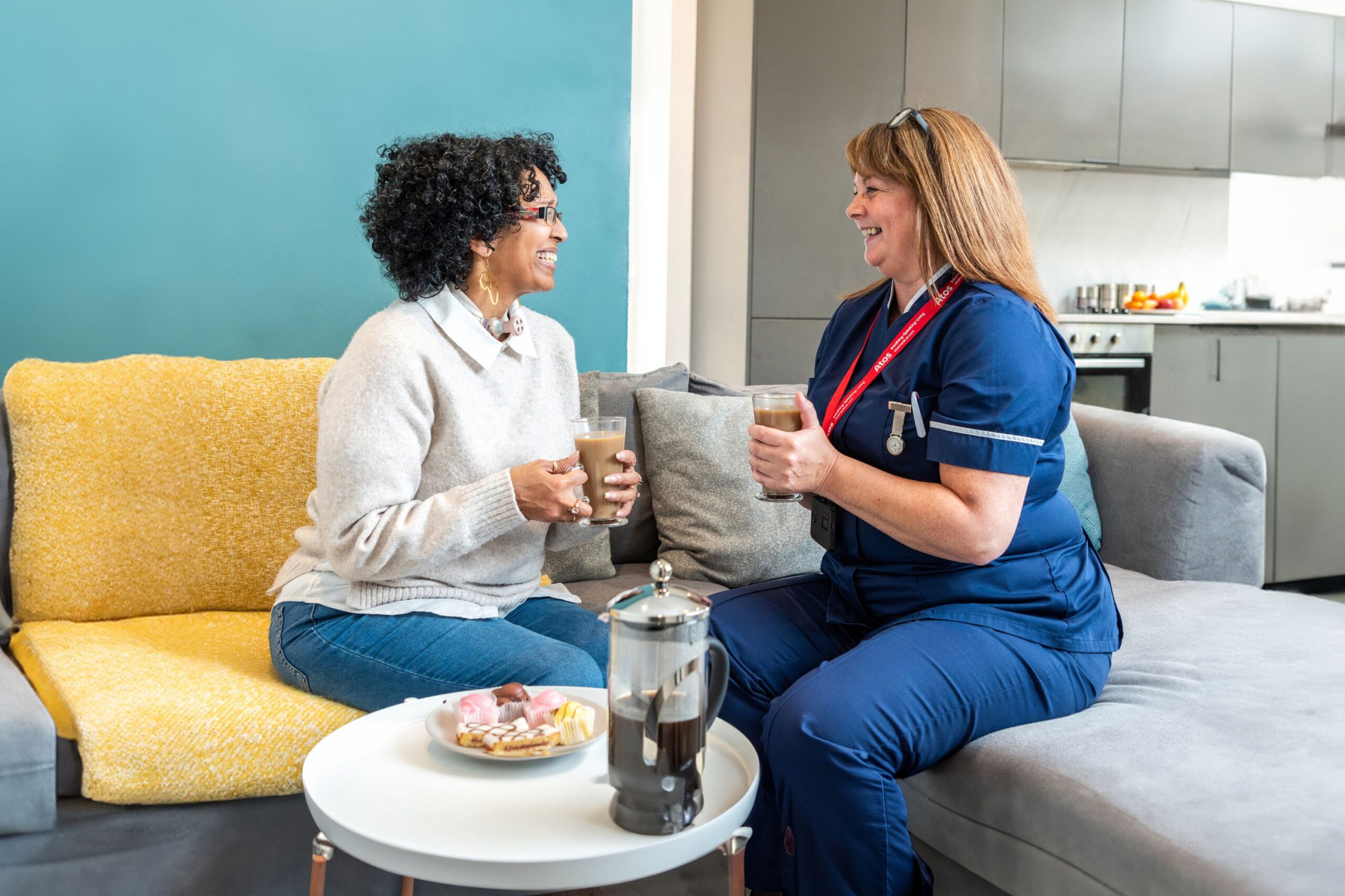 nurse and tracheostomy patient having coffee