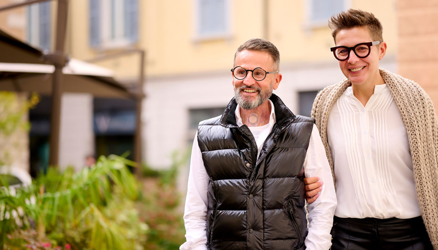 Couple walking man with stoma