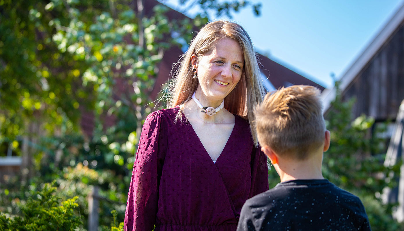 woman using freevent dualcare talking to kid outdoors